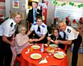 Chief Constable Sir Peter Fahy and Chief Superintendent Annette Anderson joined officers at the Christmas Spirit Project at Cherwell Centre, Heywood