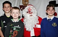 Anthony Hardiker, Tyler Watmoore and Maria Hardiker meet Father Christmas