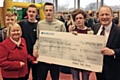 Simon Danczuk hands over a cheque for £750 to Milnrow Youth Club 