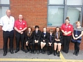 Year 8 and 9 pupils from St Anne’s Academy who have completed road safety training with (l to r) Stuart Howarth, Dave Godley and Wendy Andrew from Rochdale Borough Council’s Casualty Reduction Team and Diane Davies, the school’s PSHE co-ordinator 