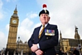 Veteran Fusilier Bob Keating outside Parliament before he stood saluting David Cameron at Prime Minister’s Questions 