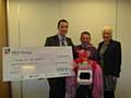 Joint MDs Arran Bangham and Tony Cliff presenting the cheque to Ann Johnson