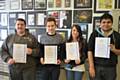 College students who did a work experience placement receiving their certificates. From left to right: James Ord, Reece Freeman, Chelsie Walton and Cheton Mistry