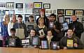 Hopwood Hall College graphic design students with their flyers.  From left to right, very back row: Michael Butterworth.  Second row: Zoe Freeman, Martyn Turner (Pacific Night Club), Pawel Tracz, Adam Haisler, Sharon Drysdale (Hopwood Hall College tutor), Chet Mistry, Sam Leeson, Mark Foxley (Pacific Night Club). Front row: Yasin Mohammed (winning design), Lois Shaw, Tina Hogarth, James Ord