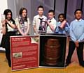 Year 7 learners from Matthew Moss High School with slavery artefacts