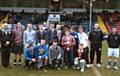 Victorious St Cuthberts with the Rochdale High Schools Rugby League Trophy alongside Hornets player Dayne Donoghue and Chairman Mark Wynn

