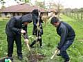 Year 10 pupils from Matthew Moss planting apple trees at Springhill Hospice as part of the Rochdale’s Jubilee Orchard Project