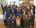 Pupils from St. Edwards C of E Primary School, Castleton taking part in a creative knitting workshop at Touchstones Rochdale with artist Alison Cooper