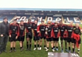 St Cuthberts, pictured with then Hornets coach John Stankevitch, lifts the 2012 trophy