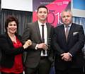 Kevin Worsley receives the Administrative or Secretarial worker of the Year Award from Ruby Wax and Mike Lee of CSC.
