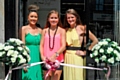 Danni Sharrocks and Kelly Turner Mitchell of 25 Ten Boutique watch as Nikki Sanderson (centre) cuts the ribbon