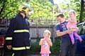 The family meet with firefighters who rescued them