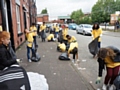 Members of the World Mission Society Church of God working in the South Street area