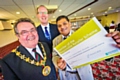 The Mayor, Councillor Peter Rush, Service Director for Economy and Environment at Rochdale Borough Council, Mark Widdup and Responsible Retailer Salamet Ali Khan, owner of Sam Sons, Durham Street, Rochdale