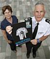 Karen Harrison of the Women's Domestic Abuse Helpline and Chief Constable Peter Fahy.