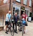 Andre Martin (left) and his son Charles set off from the Co-Operative Museum on Toad Lane in Rochdale on a 5,500 kilometre cycle ride after saying goodbye to Council Leader Colin Lambert