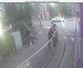 CCTV still of men wanted after woman had tooth knocked out during mugging
