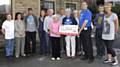 The cheque was presented to Angela and John Bannister from the Christie Hospital by Marjory Hawker-Bond, MBE with Andy O’Sullivan MBE and the Andems Runners