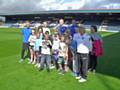 Captain Peter Cavanagh and defender Joe Rafferty meet some of the youngsters who took part in the Rochdale Borough Housing activities