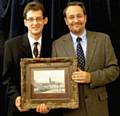 President Neil Helliwell and Nick Hall holding LS Lowry sketch