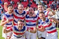 Jubilant Hornets players after winning the play-off final