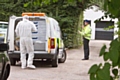 Crime scene investigators at the house on Manchester Road, Hopwood, Heywood