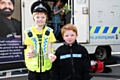 Kian and Euan Lock dress up in police uniforms