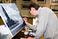 Geoff Butterworth painting at his exhibition