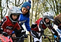 Young BMX riders Oliver Stansfield and Joe Matthias being coached on the gate by Shanaze Reade