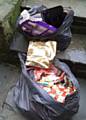 Black bin bags containing present wrappings dumped from a white Vauxhall Zafira on Christmas Day whilst driving down Ashworth Road