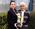 Elliot Blant-Harwood and Mia Linnik-Holden with their Children in Need Strictly Come Dancing special trophy