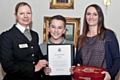 Lewis Threlfall receiving his Rochdale Division Commander's Certificate from Chief Superintendent Annette Anderson