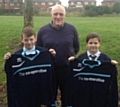 Keith Hicks, Rochdale AFC Football in the Community Trust Manager, with Liam Greenwood and Ella Mooney, who are pupils at Alkrington Primary School