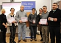 Takeaway owners learn about health improvement from Rochdale Borough Council's Ve Nutter (left) and Clare McNichol (third from right) during National Chip Week
