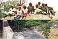 Top: Local children<br />
Bottom: The completed sand dam