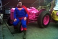 Mark Wickham dressed as Superman with his pink tractor