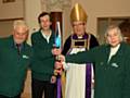 Jeffrey Hain and his son Christopher with    The Rt Revd Nigel McCulloch, retired Bishop of Manchester and Marion Hain