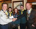 Rotary Club of Heywood President Phil Corns handing the cheque to Craig Pullen with Scouts Cara Walch, Cerys Shackleton and Kieran Butterworth
