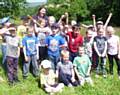 Judy Alderson, back, with Year 2 pupils at Holy Trinity School at a Forest School session