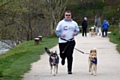 Winner of the Doggy Dash for Life, Sam Butterworth with dogs Tilly and Max