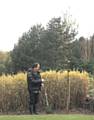 Richard Tang plants tree in support of World Earth Day 2014 
