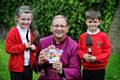 Angel Alexander aged 7 and Kaiden Standring aged 7 with the The Bishop of Middleton Mark Davies 