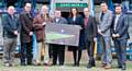 RLWC2013 General Manager Sally Bolton presents the Rochdale Consortia with a commemorative photo. (L to R) Mark Wynn, Chairman of Rochdale Hornets, John Dutton, Operations Manager at RLWC2013, Cllr Martin Burke, Chairman of the stadium company, Paul Swarbrick, Stadium Manager, Council Leader Colin Lambert, council Communications Manager Mark Roberts and Rochdale Hornets Chief Executive, Ryan Bradley.