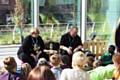 Young Persons' Library Worker Ray Stearn reading stories, with town centre chaplain Reverend Margaret Smith