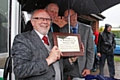 Jim Dobbin MP, Thornham Cricket Club President Kevin McMahon and Club Chairman Ian Heywood with a memorial plaque to Harold Hare 