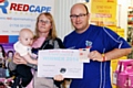 13-week-old Charlie with his Auntie Amanda Shaw and Wheatsheaf Centre Manager Martin Ballard