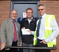 George Kinder and Norman Ashton from the Heywood Charities Fete receiving a cheque from Derek Wroe, Manager at the Heywood Branch of Robert Scott Ltd