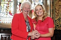 Katie Bowmer receiving her Junior Woman of Rochdale award from Dame Mary Peters