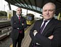 GMP Coordinator for Operation Alloy, John Woods and TfGM Metrolink Director, Peter Cushing at the Central Park Metrolink stop