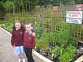 Louise and Payton picking perennial plants